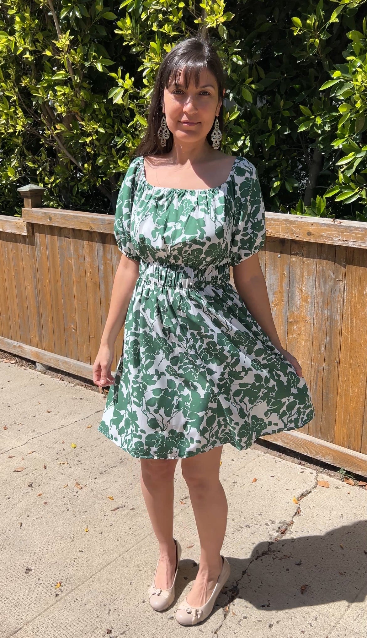 Woman in GreenOff-Shoulder Puff Sleeve Floral Mini Dress facing forward