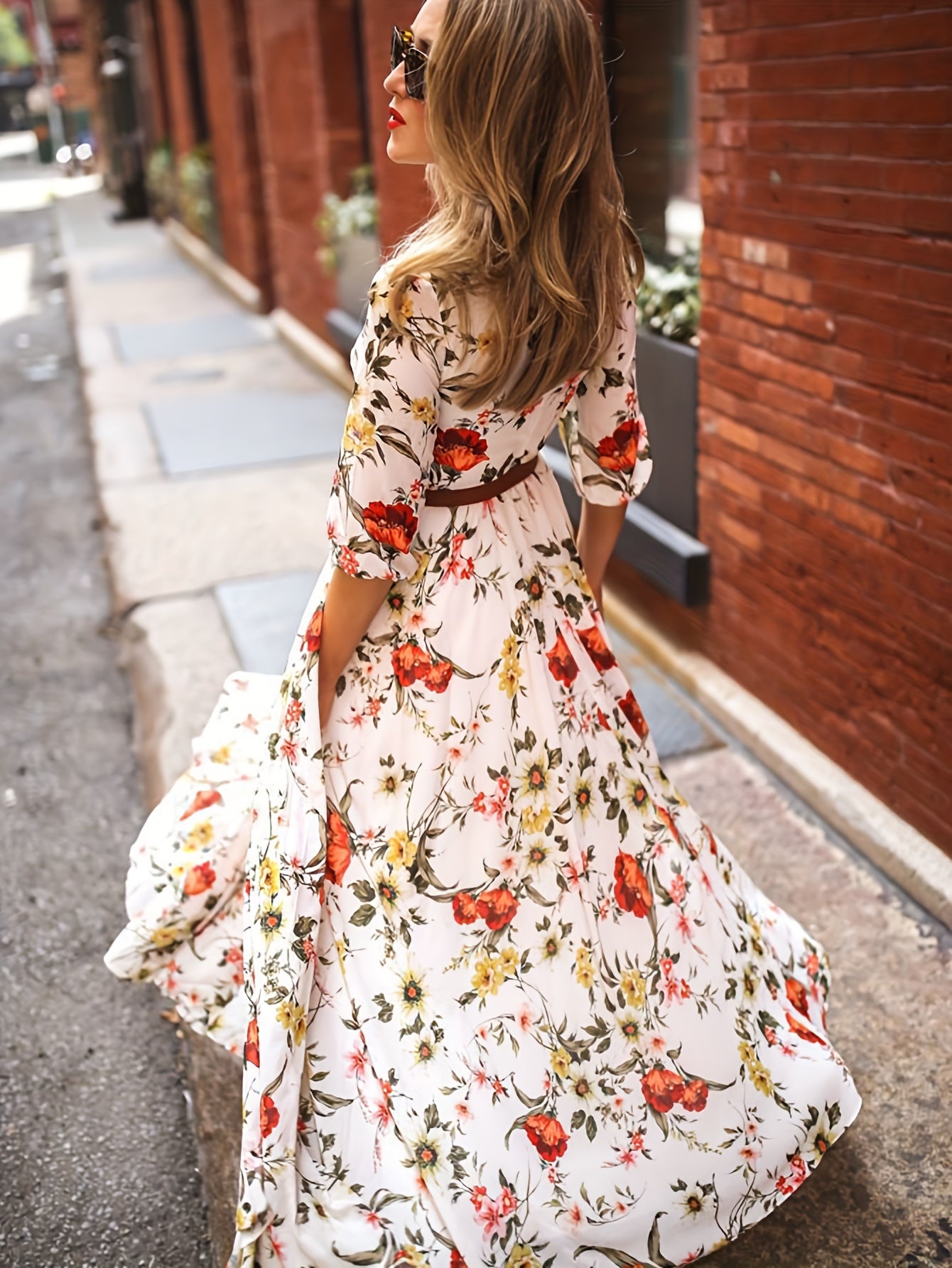 Woman in Cream Floral A-Line Maxi Dress with 3/4 Sleeves facing backwards