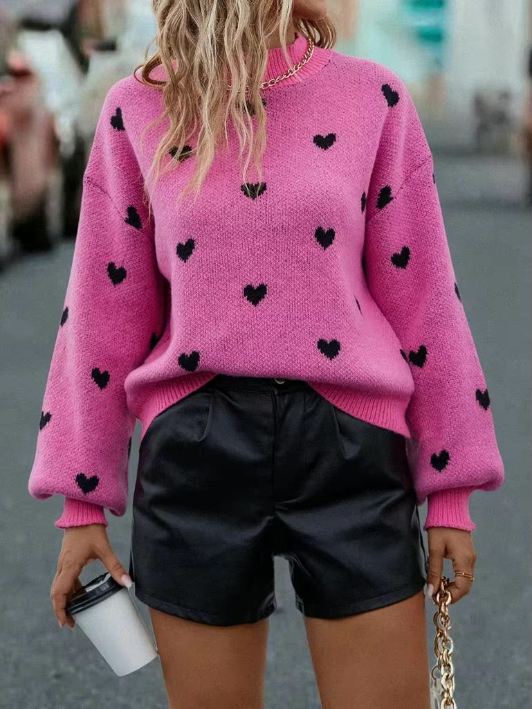 Woman in Fuchsia Heart Pattern Knit Sweater facing forward up close