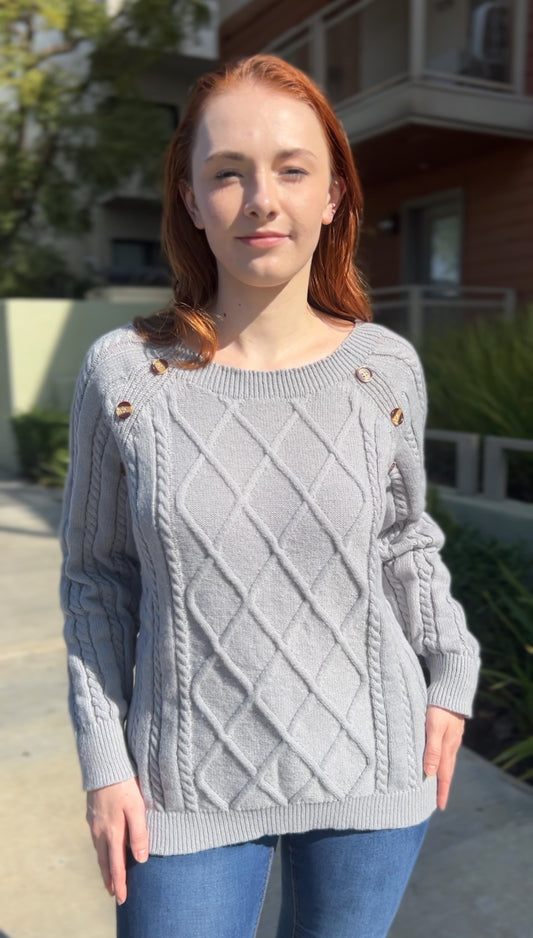 Woman in Gray Cable Knit Raglan Sweater facing forward up close
