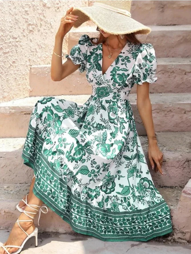Woman in Green & White Floral Midi Dress facing forward sitting down