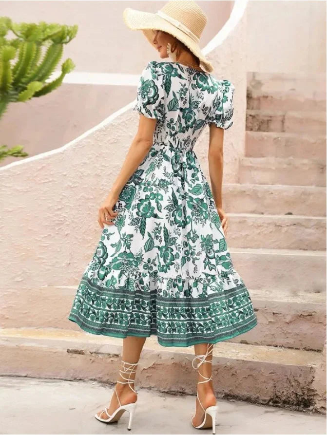 Woman in Green & White Floral Midi Dress facing backwards