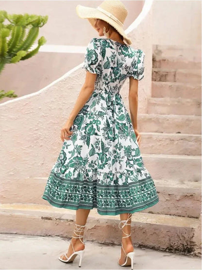 Woman in Green & White Floral Midi Dress facing backwards