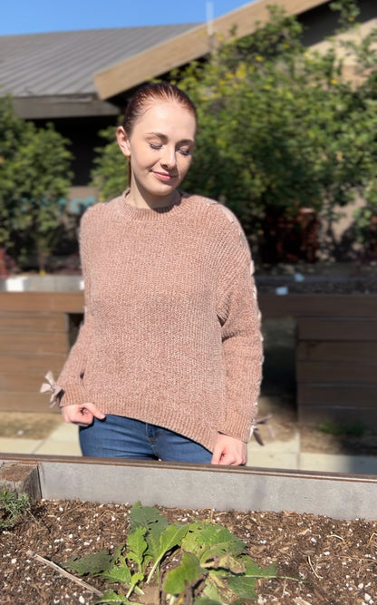 Woman in Khaki Lace Up Sleeve Knit Sweater facing forward up close