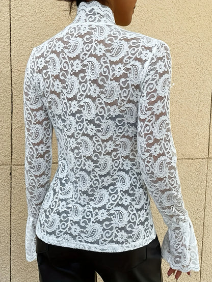 Woman in White Floral Lace Mock Neck Top with Flare Sleeves facing backwards up close